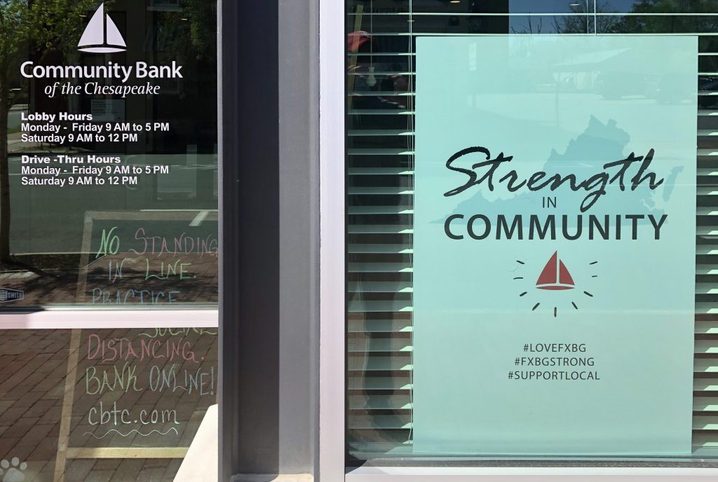 Strength in Community poster in window
