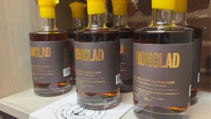 Bottles of bourbon with yellow bolded text reading "IRONCLAD," with yellow tops
