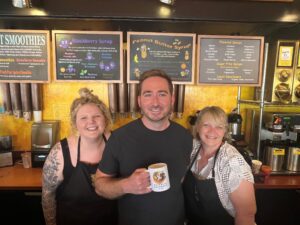 Heather Evans, Jack Scholl, Amanda Jones standing in Hyperion Coffee