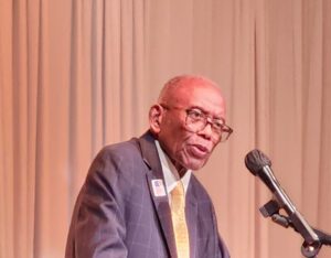 Man speaking into microphone.