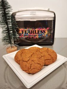 Cookies on plate with napkin holder.