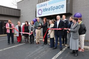 Group standing in front of CRRL IdeaSpace building for ribbon cutting.