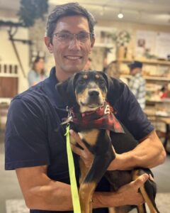 David Fraser holding dog.