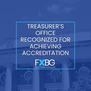 White text on blue background stating treasurer's office recognized for achieving accreditation.